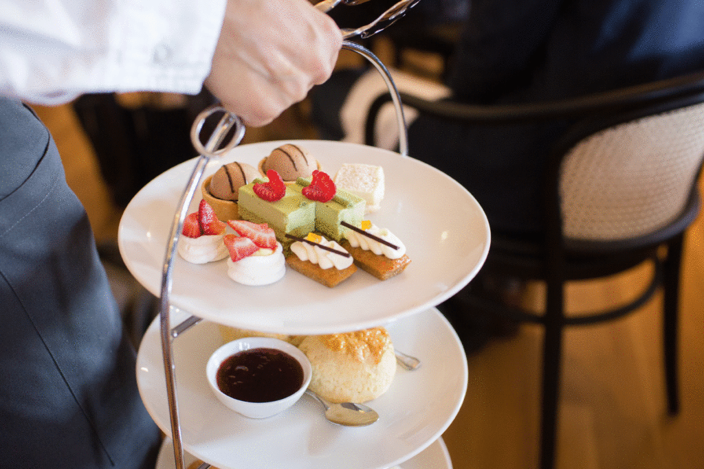 Chocolate cremeux dome tarts, pistachio raspberry delice, passion fruit strawberry pavlova and more top the Empress' three-tiered platter. Photo: Lucas Anderson